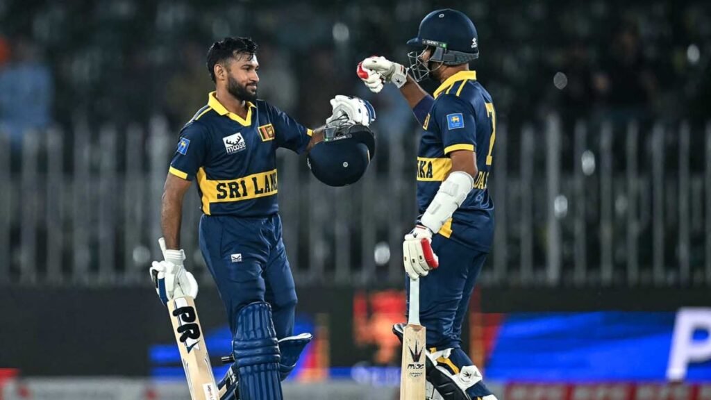 Sri Lanka batters Pavan Rathnayake and Dasun Shanaka bump gloves in the middle during their record chase against England at Rawalpindi Cricket Stadium