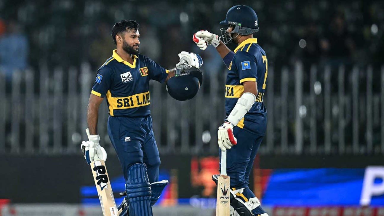 Sri Lanka batters Pavan Rathnayake and Dasun Shanaka bump gloves in the middle during their record chase against England at Rawalpindi Cricket Stadium